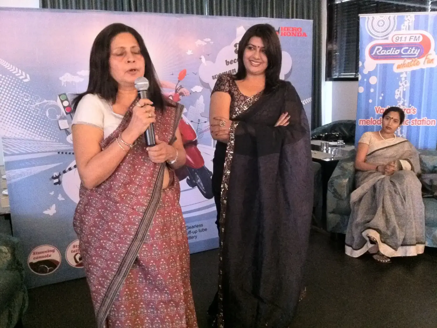 Man in suit speaking at podium with ITT logo on podium